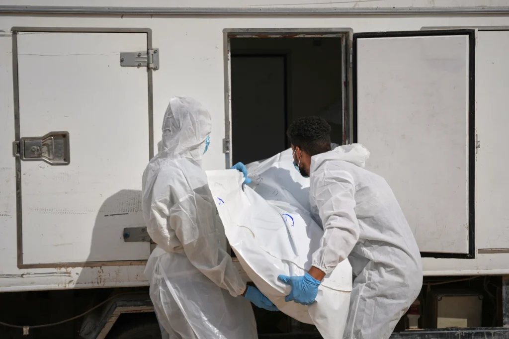 Israel returns 15 Palestinian bodies to Gaza as displaced families struggle through winter rains